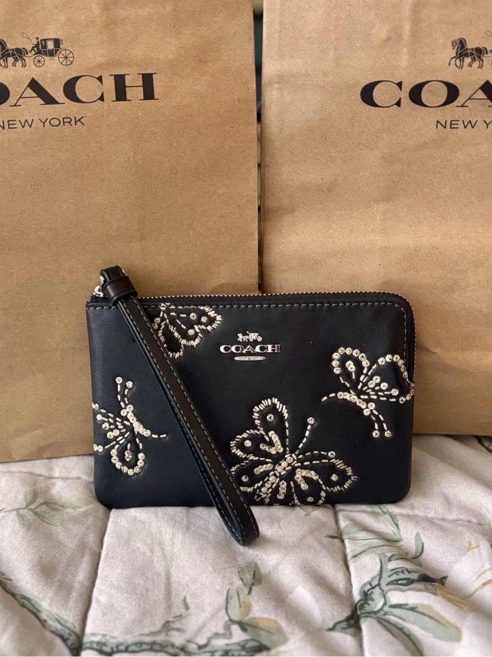 COACH Black Leather Wristlet with Sequin Butterfly Accents